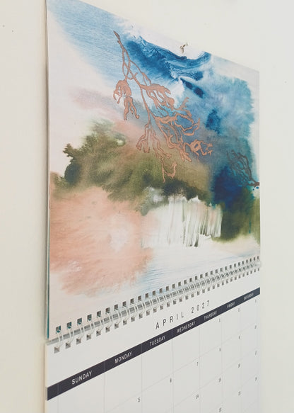 2027 Fine Art Calendar hanging on the wall, close up